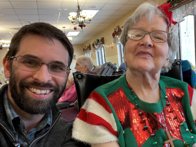 Pastor Joel Pike poses for a picture with a resident.